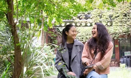 Students sat in a garden